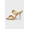 Golden mules with stiletto heels