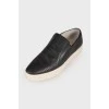 Perforated leather slip-ons