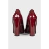 Maroon patent leather shoes
