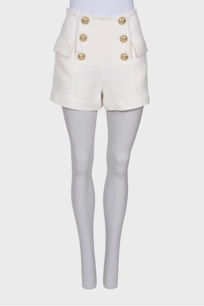 White shorts with golden buttons