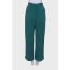 Green trousers in print