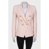 Pink jacket with golden buttons