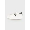 White leather sneakers with appliqué