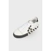 Sneakers black and white Vulcanized, with a tag