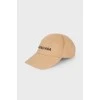 Beige cap with tag