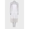White dress with pleated hem