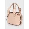 Beige leather bag with thin strap