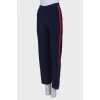 Knitted trousers with red stripes