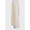 Beige palazzo trousers with tag