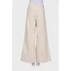 Beige palazzo trousers with tag
