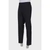 Men's classic black trousers with a tag