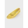 Yellow perforated ballerina shoes