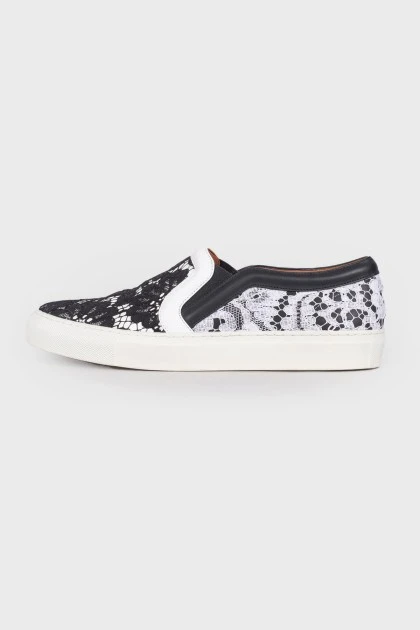 Black and white lace slip-ons