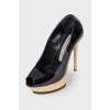 High-heeled patent leather shoes