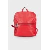 Red backpack with silver hardware