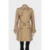 Beige trench coat with pockets