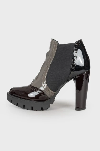 Perforated patent leather ankle boots