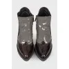 Perforated patent leather ankle boots