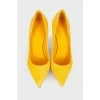 Yellow suede pumps