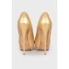 Gold-tone open-toed shoes