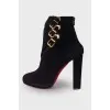 Suede ankle boots with gold buckle