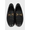 Leather loafers with gold trim