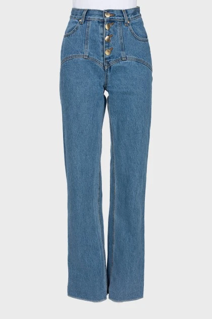 Jeans with asymmetrical button seams