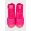 Bright pink trainers with perforations 
