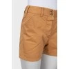 Beige shorts with buttons
