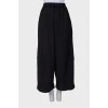 Black trousers with drawstring bottom