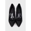 Black pointed toe pumps