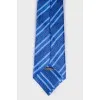 Blue tie with tag print
