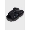 Black slip-on sandals with chunky soles