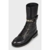 Leather boots with gold logo