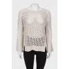 Wool sweater with perforations