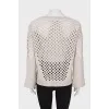 Wool sweater with perforations