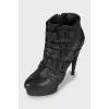 Leather ankle boots decorated with buckles