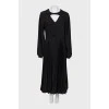 Black dress with pleated hem