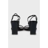 Black sandals with snakeskin embossing