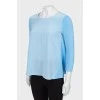 Light blue loose-fitting blouse