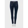 Dark blue jeans with gold buttons