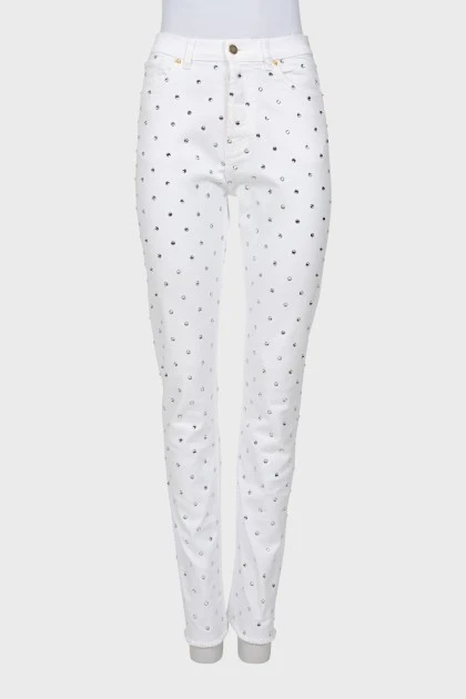 White jeans decorated with rhinestones