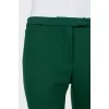Green tapered trousers