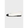 Black and white ballet flats