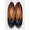 Patent leather shoes with perforations