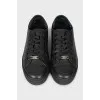Leather sneakers with branded embossing