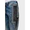 Jeans decorated with rhinestones and lace