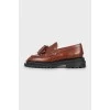 Brown loafers with tag