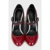 Patent leather shoes with decorated heels