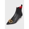 Leather ankle boots with gold logo